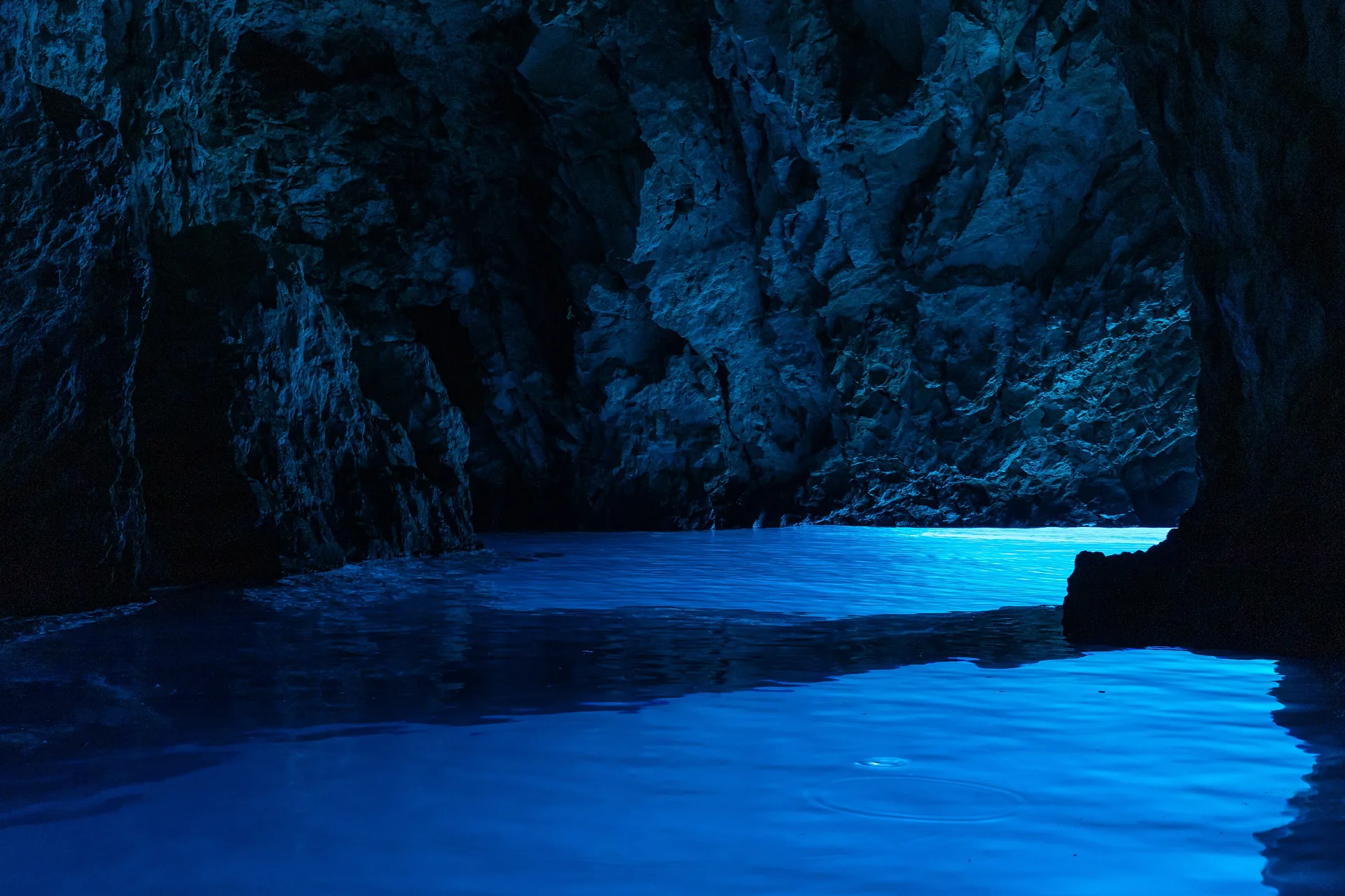 Electric blue light glowing inside the Blue Cave on Biševo island, Croatia